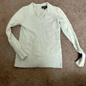 Cute blue sweater with fun button back